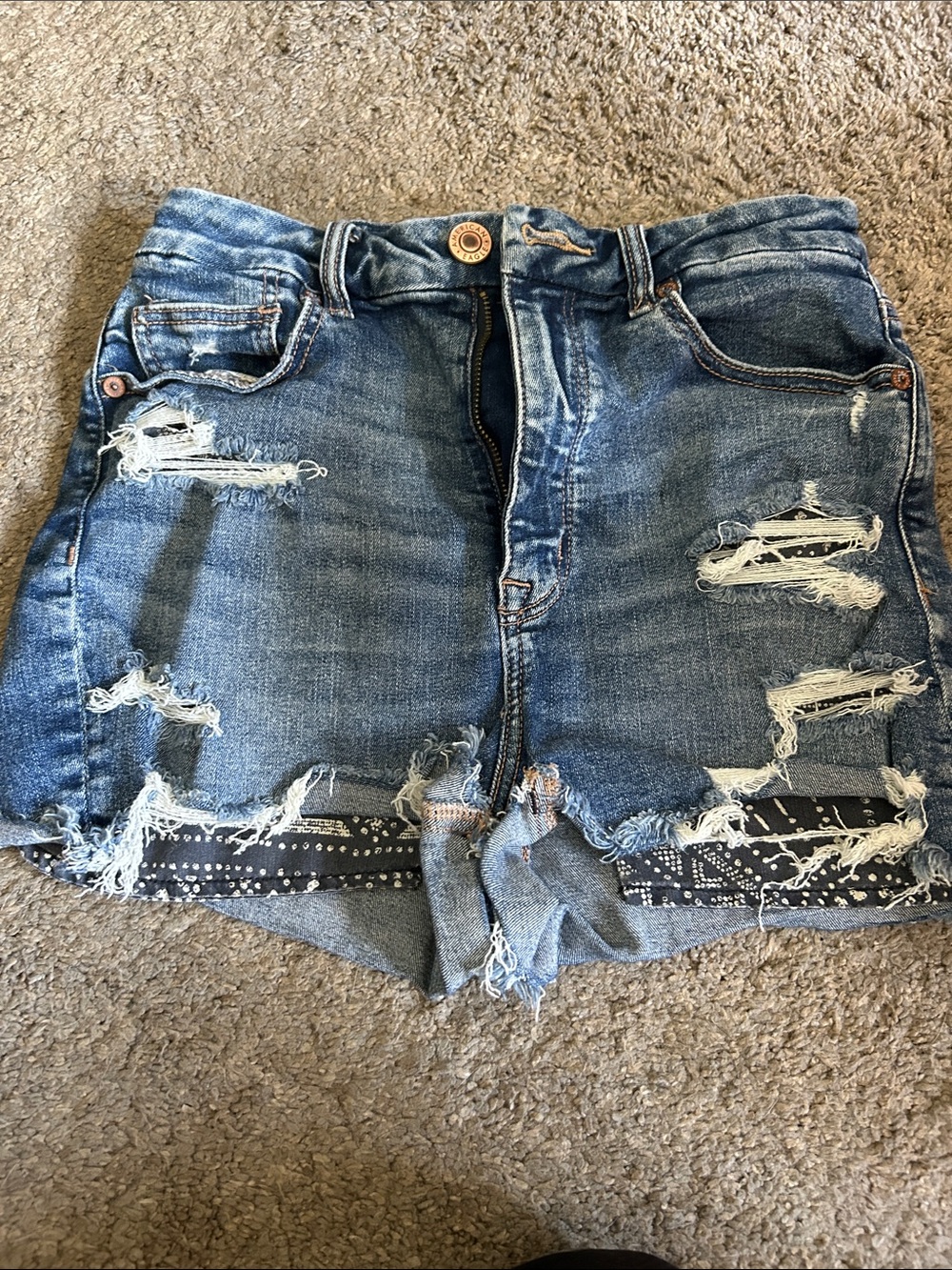 Women's Distressed Blue Denim Shorts with Frayed Hem